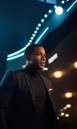 a man wearing a black suit and bow tie