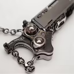 a black pocket knife is attached to a chain