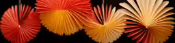 three decorative red and yellow fans on a black background