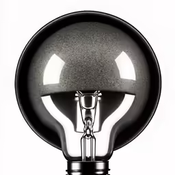 a metal object in black and white with a light bulb