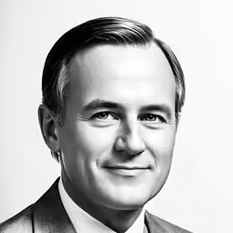 a black and white photo of a man in suit