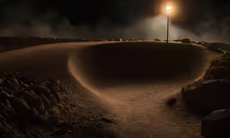 the light is glowing on a lonely road