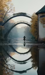 a person standing on a platform above water under a bridge