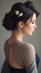 the back view of an asian woman wearing a floral hair piece