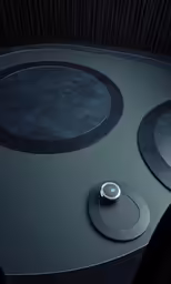 an unusual round table has two circular buttons on it