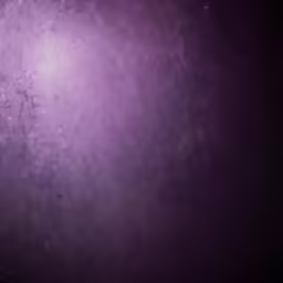 a space filled with a lot of bubbles floating on top of a purple backdrop