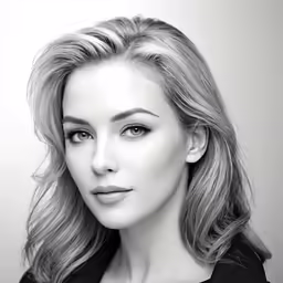 a woman is looking at the camera with a frown