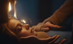 there is a person touching the hands of a woman
