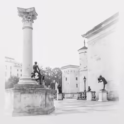 the fountain at the end of a city street