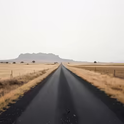 a lonely rural road running through dry land