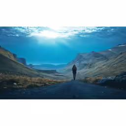 a person walks down a gravel road in an expanse