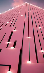 a large pink building with white lit lamps on the side of it