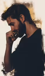the young man has his chin on his finger