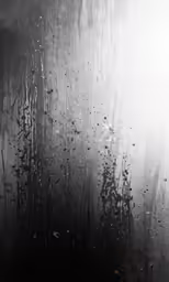 raindrops sitting on the window in the middle of a building