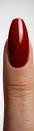 a person with red nails is holding their thumb up