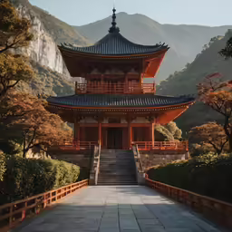 a pagoda with a mountain backdrop in the background