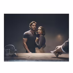 there is a man and a woman standing at the table