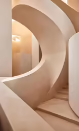 a large room with spirally shaped cement walls