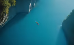 two people are floating down a body of water