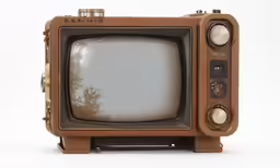 an old tv sitting on top of a table