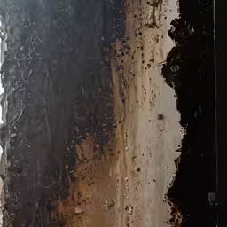 a view from a plane window of a dirt field