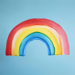a painted rainbow with blue background is featured