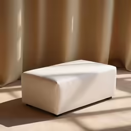 a white leather stool in a room