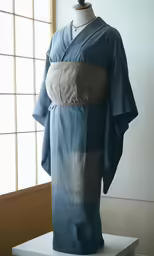 an oriental inspired, blue kimono with grey sides