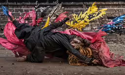 a man on his back with a cloth tied to his body