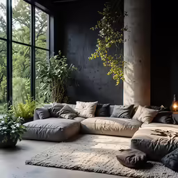 a large living room with large windows and a large rug on the floor