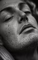 a man covered with white speckles sleeps on a bench