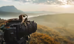 a video camera on a tripod overlooking the landscape