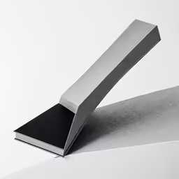 an empty piece of grey concrete near a white background