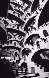 people in an underground walkway with stairs