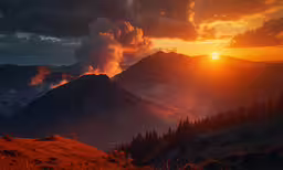 the sun sets over some mountain tops with some clouds
