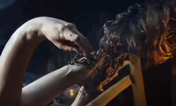 a person is getting their hair brushed