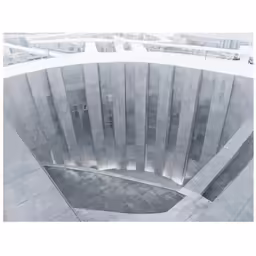 an angled view of the outside of a concrete building