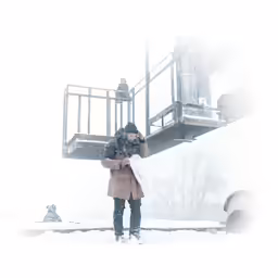 a person on a cellphone near a building