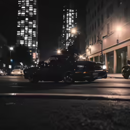 some cars at a city street light traffic and buildings