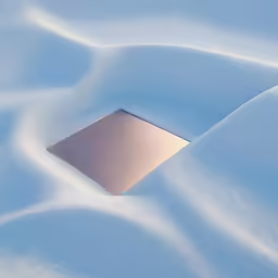 the snow is covering the surface and the square shaped object is in it
