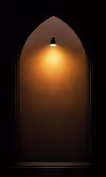 a large arch with light coming out at the end