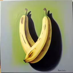 three bananas mounted to a plastic wall
