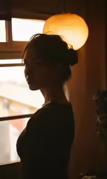 the light is coming from an unfinished lamp shade on a woman