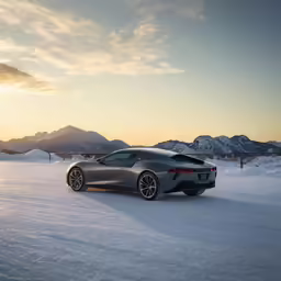 a sports car sitting out in the snow