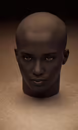 a dark skinned man with short hair is shown