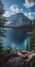 a scenic view from atop a mountain on a sunny day