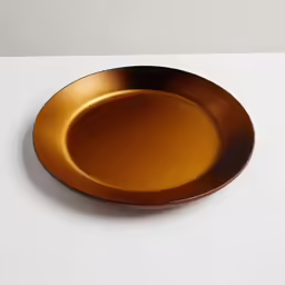 an oval plate sits on a plain surface