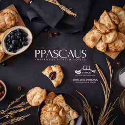a photo of pastries on display on a black surface