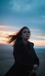 a woman with her wind blown hair flying