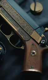 there is a gun on the table with black fabric